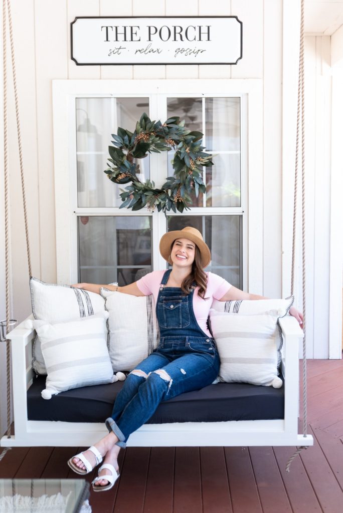 brand image of female health coach sitting on a porch swing; taken by Robin Collette Photography, Sacramento Brand Photographer